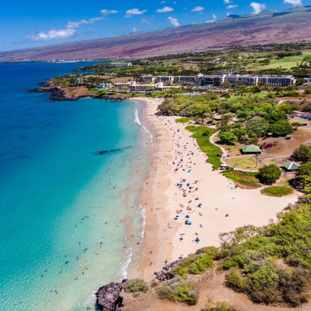 35 Best Things To Do On The Big Island Hawaii Calling a beach with people and trees