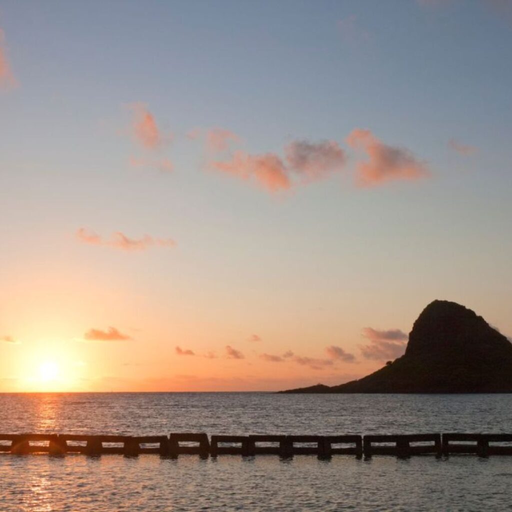15 Best Snorkel Tours On Oahu | Book These Early Hawaii Calling a sunset over a body of water