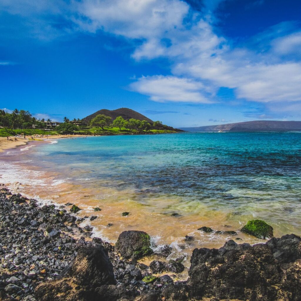 Snorkeling on Maui: The Ultimate Guide To 27 Amazing Spots Hawaii Calling a beach with rocks and trees