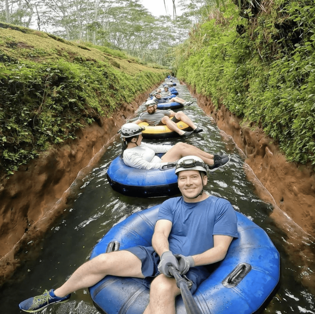 The 30 Best Things To Do On Kauai | A Bucket List Guide (2025) Hawaii Calling a group of people on tubes in a river