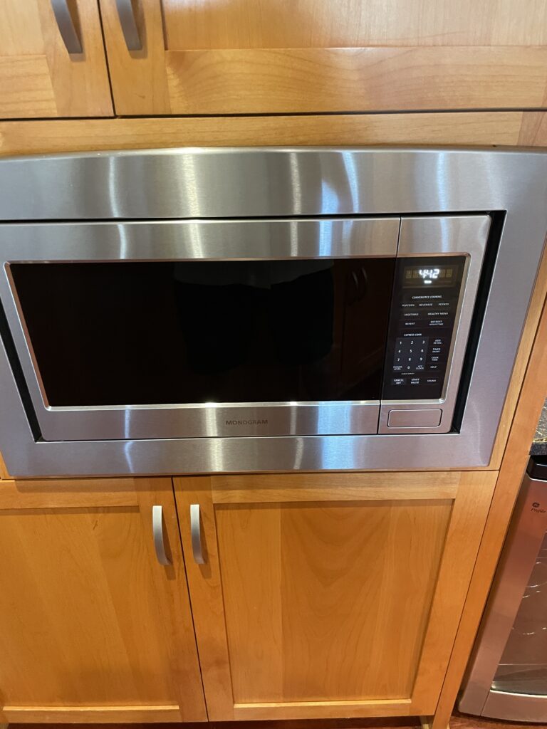 Review Montage Kapalua Bay | Maui Luxury Hawaii Calling a microwave on a cabinet