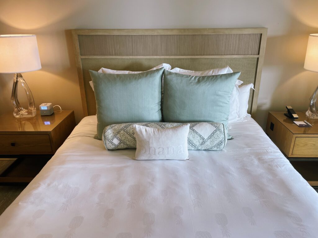 Review Montage Kapalua Bay | Maui Luxury Hawaii Calling a bed with pillows and a lamp