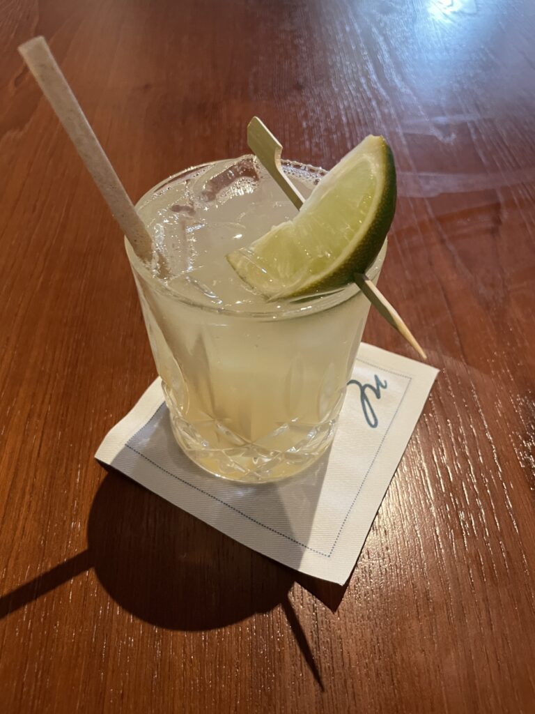 Review Montage Kapalua Bay | Maui Luxury Hawaii Calling a glass with a drink and a lime slice on a napkin