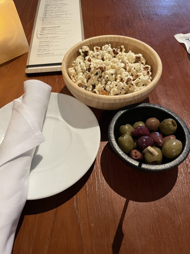 Review Montage Kapalua Bay | Maui Luxury Hawaii Calling a bowl of popcorn and olives on a table