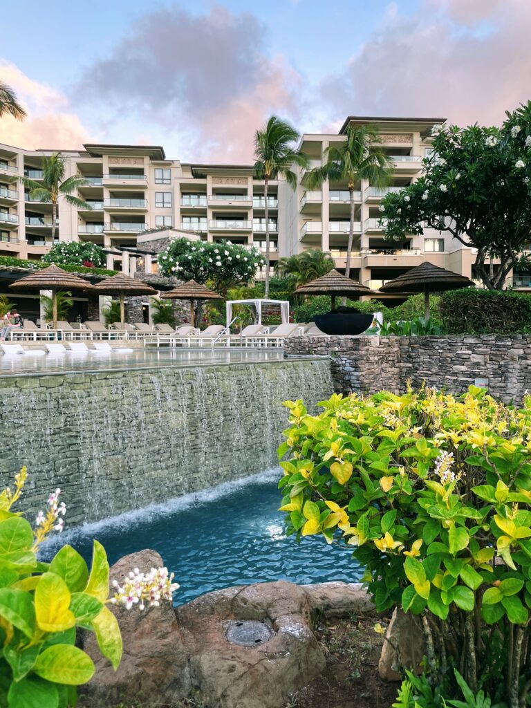 Review Montage Kapalua Bay | Maui Luxury Hawaii Calling a pool with a waterfall in front of a building