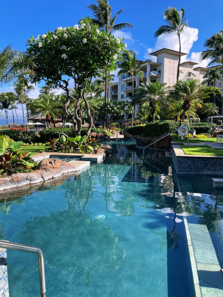 Review Montage Kapalua Bay | Maui Luxury Hawaii Calling a pool with trees and buildings in the background