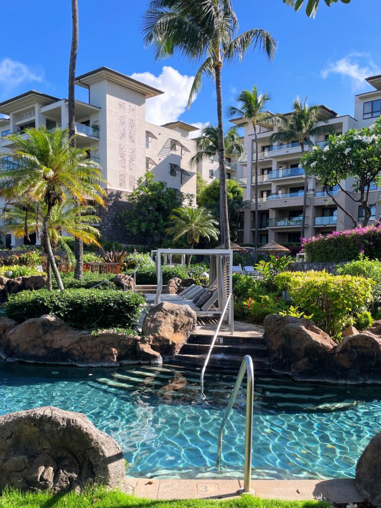 Review Montage Kapalua Bay | Maui Luxury Hawaii Calling a pool with a swimming pool and palm trees