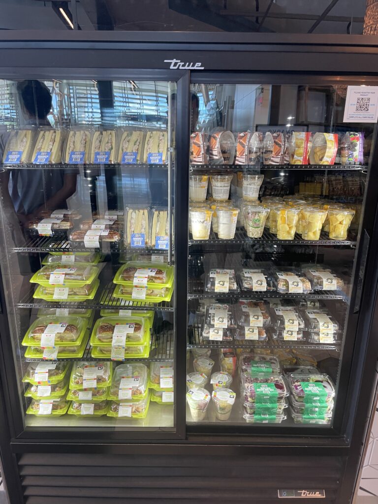Mauka Market Restaurant Review | Excellent Food At Honolulu Airport Hawaii Calling a display case with food in it
