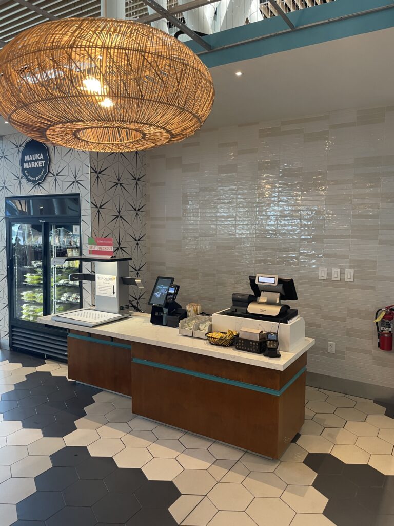 Mauka Market Restaurant Review | Excellent Food At Honolulu Airport Hawaii Calling a counter with a basket from the ceiling