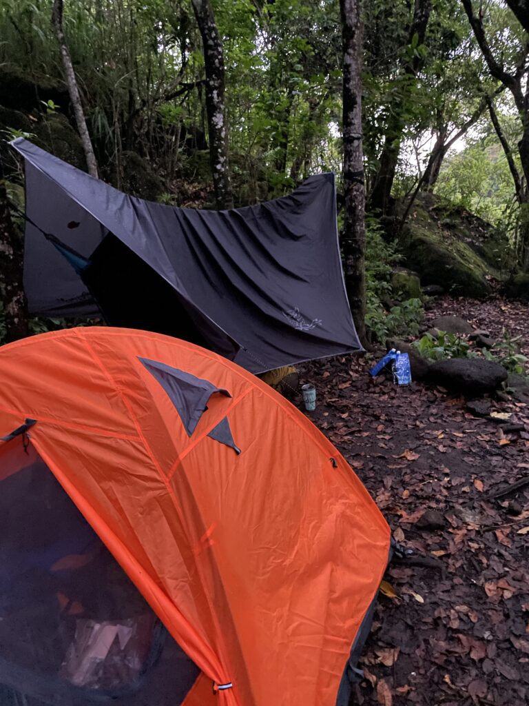 Kalalau Trail Adventure: My Unforgettable Hiking Experience on Kaua'i Hawaii Calling a tent in the woods