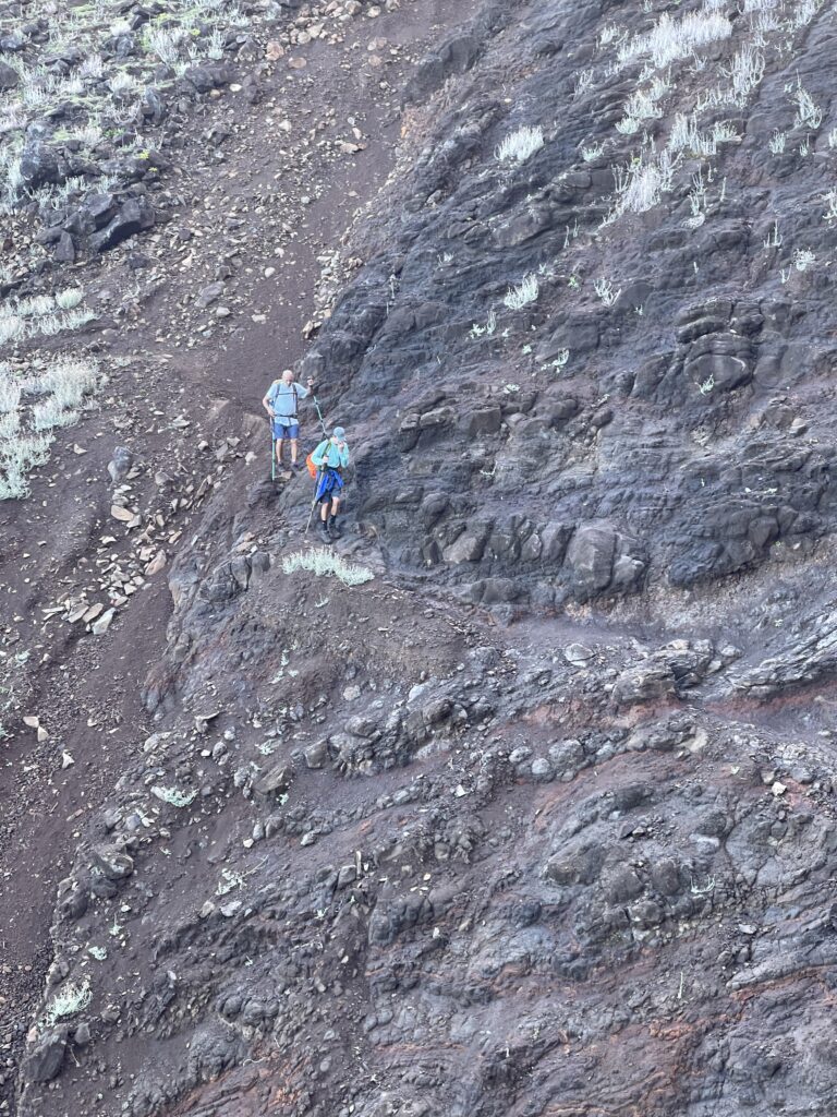 Kalalau Trail Adventure: My Unforgettable Hiking Experience on Kaua'i Hawaii Calling a group of people hiking on a rocky mountain