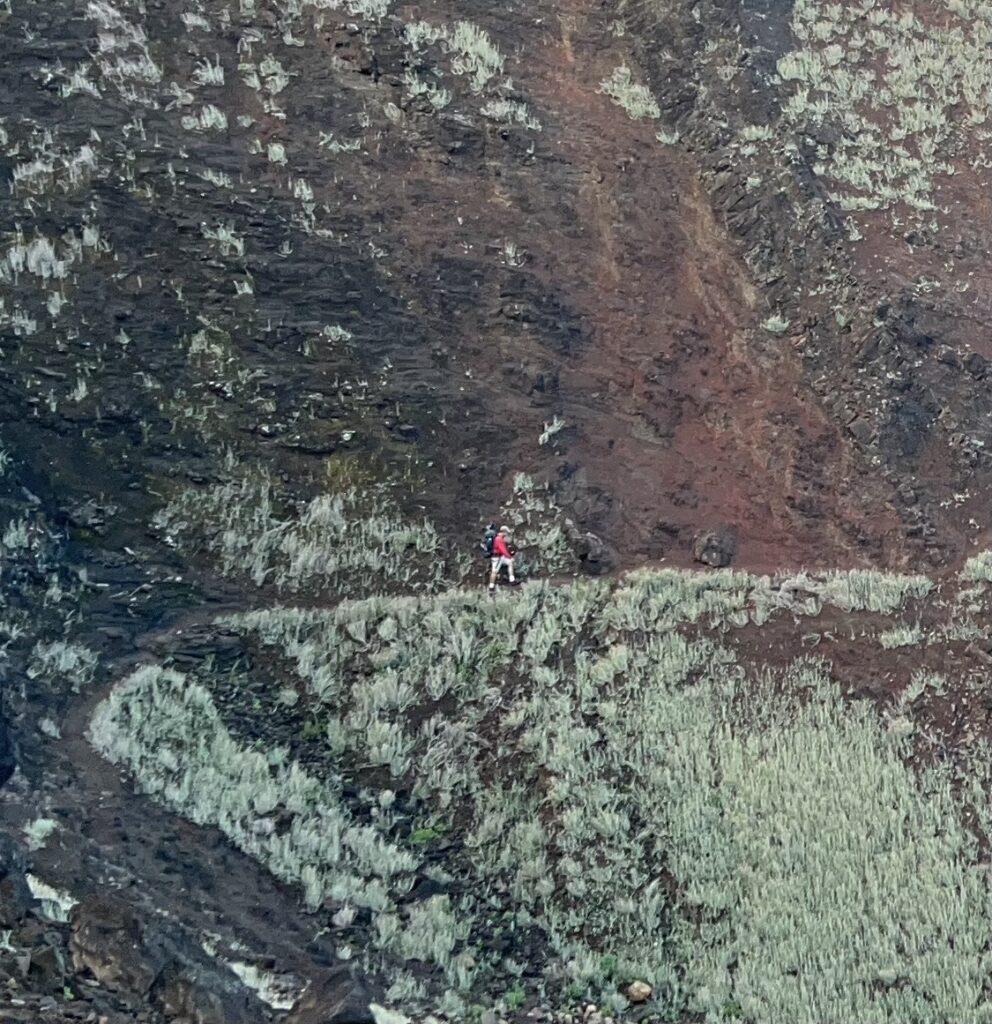 Kalalau Trail Adventure: My Unforgettable Hiking Experience on Kaua'i Hawaii Calling a person walking on a rocky hill