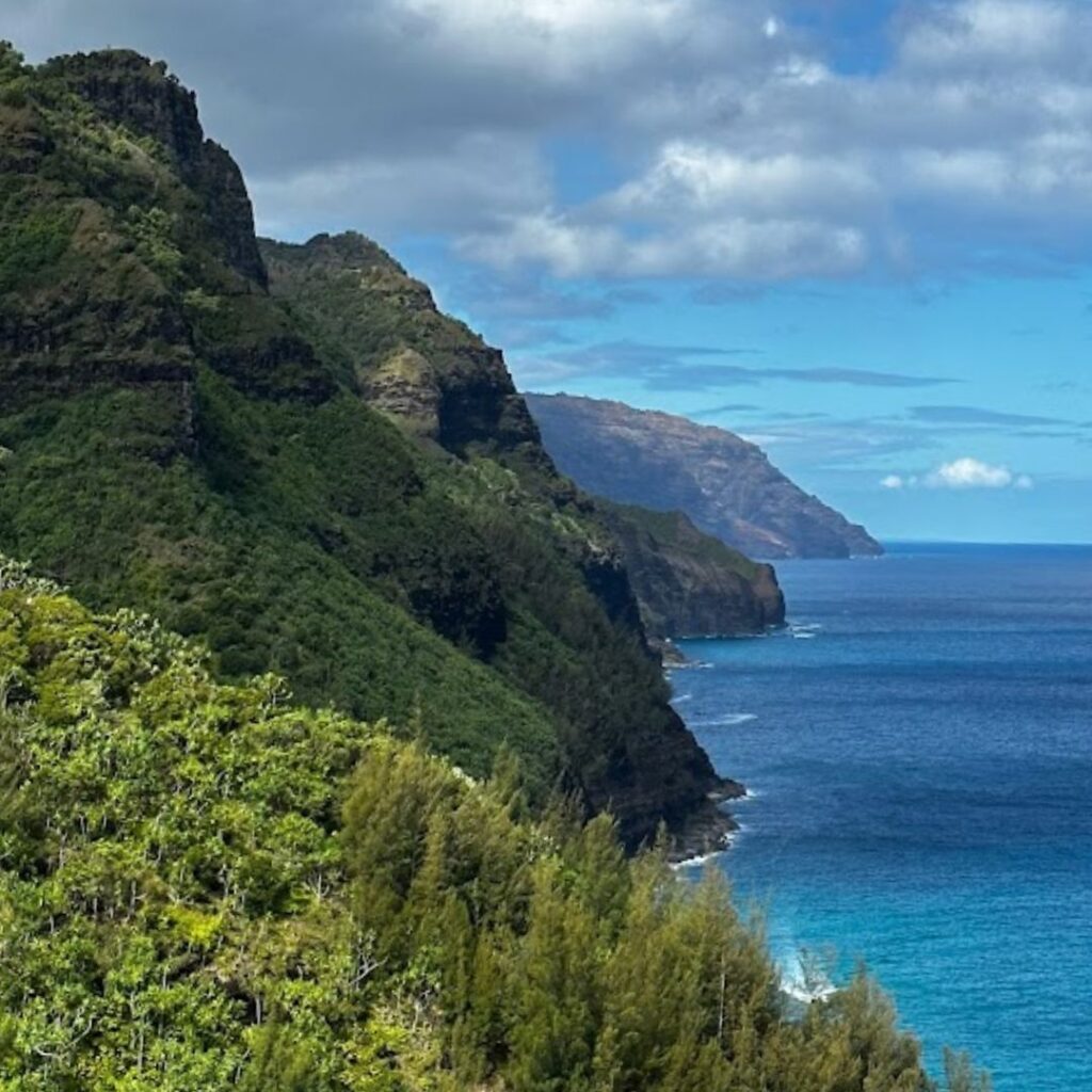 Kalalau Trail Guide: Planning Your Ultimate Hiking Adventure Hawaii Calling a green hills and blue water
