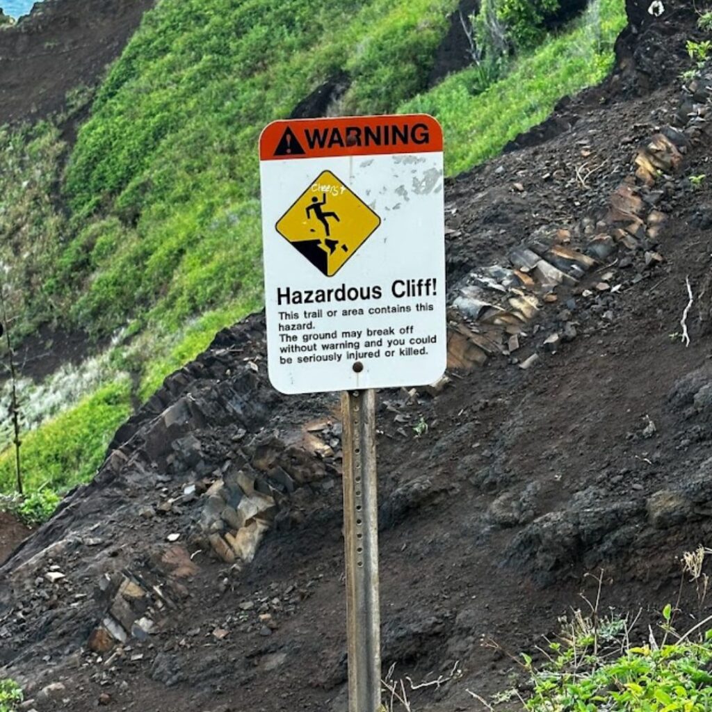 Kalalau Trail Guide: Planning Your Ultimate Hiking Adventure Hawaii Calling a sign on a pole