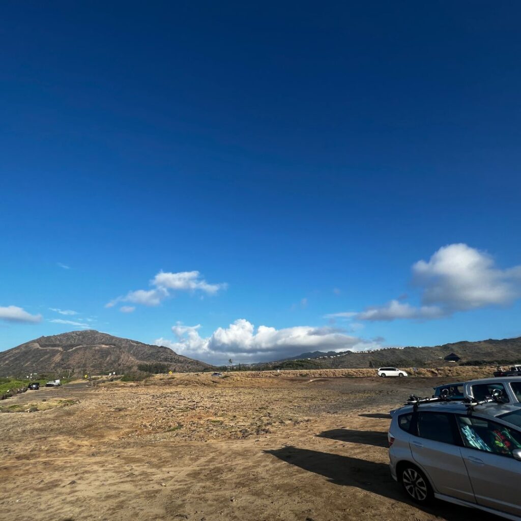 Kaloko Inlet Restoration: The Ultimate Coastal Volunteer Opportunity Hawaii Calling cars parked cars in a dirt field