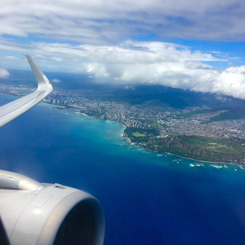 How Long Are Flights To Hawaii? A Look At The Timeline To Paradise Hawaii Calling View of Waikiki from an airplane. Many people who want to experience this will be asking, how long are flights to Hawaii? This article will answer this with in-depth detail.
