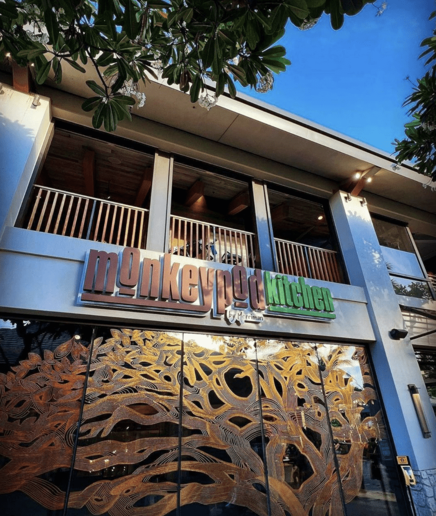 Discover Waikiki's Hottest New Spot: Monkeypod Kitchen by Merriman Hawaii Calling a building with a large glass door