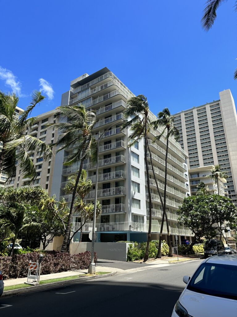 Courtyard by Marriott Waikiki Beach Review | Perfectly Positioned Hawaii Calling a tall building with palm trees