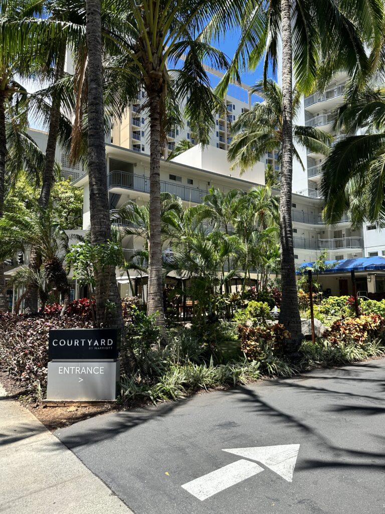 Courtyard by Marriott Waikiki Beach Review | Perfectly Positioned Hawaii Calling a sign in front of a building