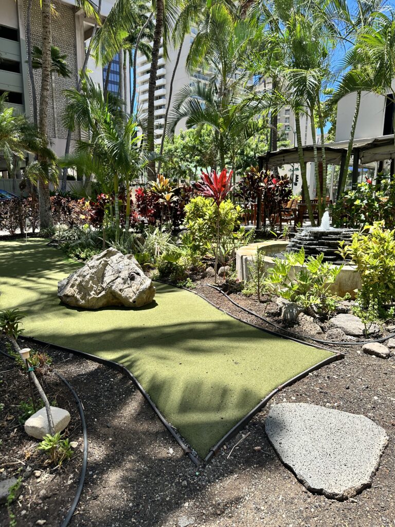 Courtyard by Marriott Waikiki Beach Review | Perfectly Positioned Hawaii Calling a golf course with a fountain and trees