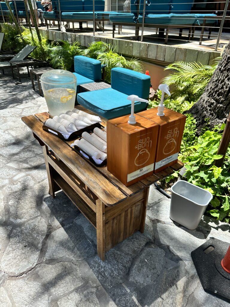 Courtyard by Marriott Waikiki Beach Review | Perfectly Positioned Hawaii Calling a table with a drink and a box of hot dogs on it