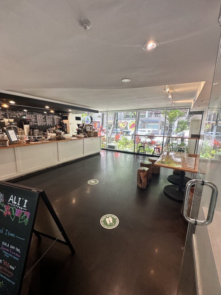 Courtyard by Marriott Waikiki Beach Review | Perfectly Positioned Hawaii Calling a room with a black floor and a black sign
