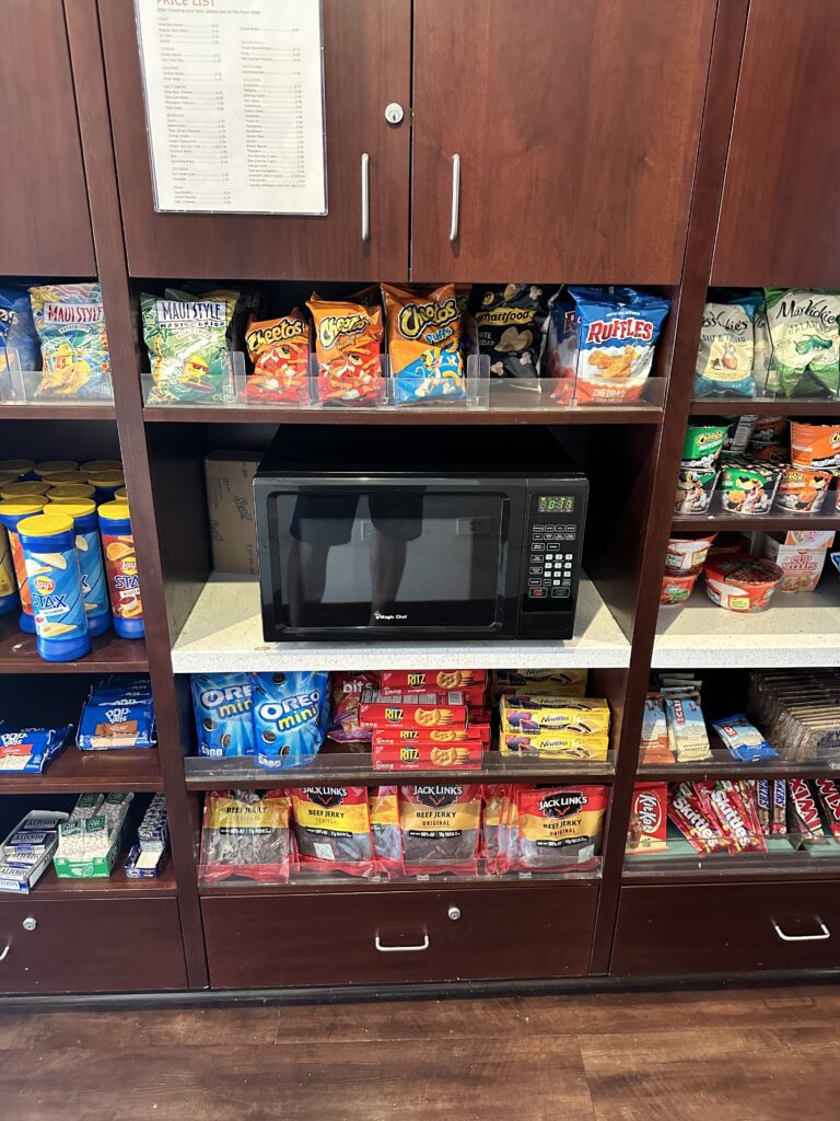 Courtyard by Marriott Waikiki Beach Review | Perfectly Positioned Hawaii Calling a shelf with food on it