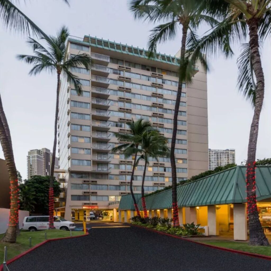 20 Best Budget Hotels On Oahu (2025) Comfort and Convenience for Every Wallet Hawaii Calling a palm trees next to a building