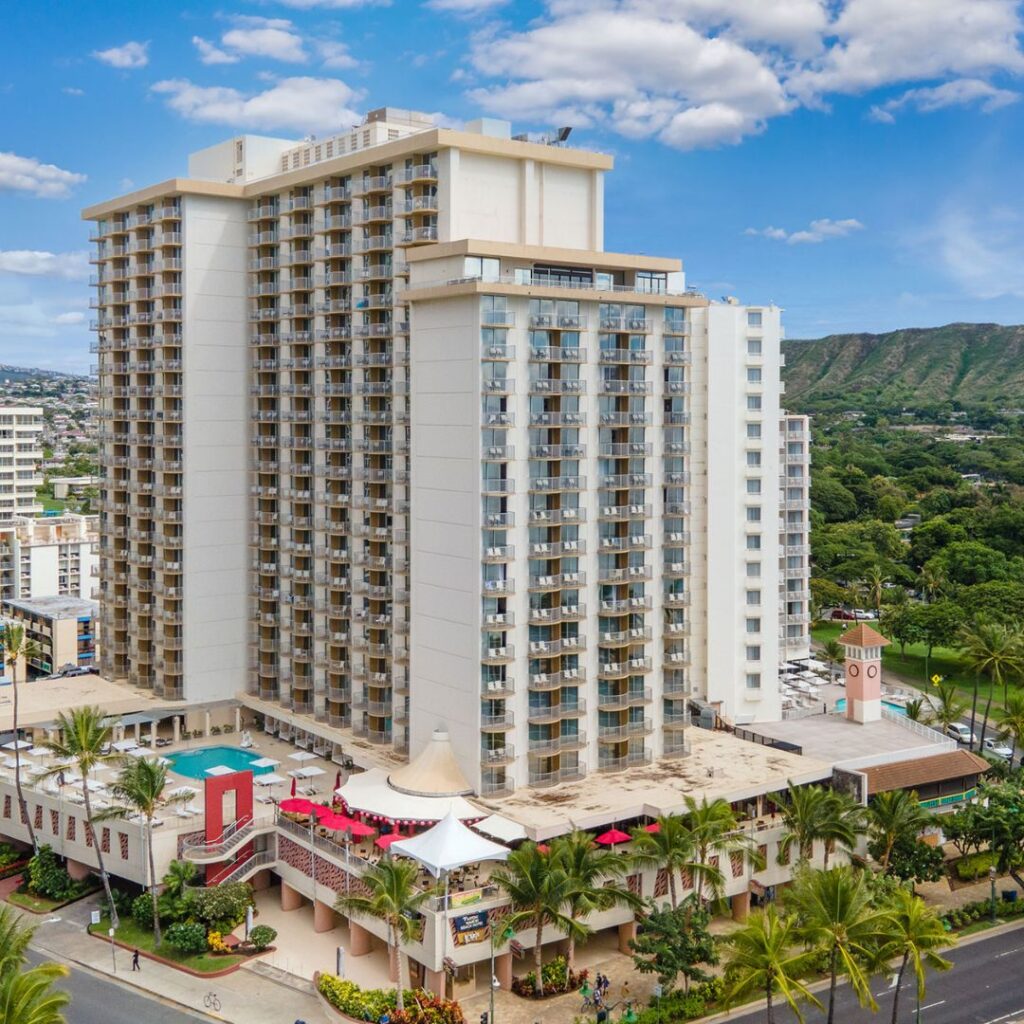 20 Best Budget Hotels On Oahu (2025) Comfort and Convenience for Every Wallet Hawaii Calling a large building with many balconies and trees