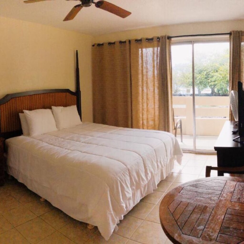 a bedroom with a bed and a table