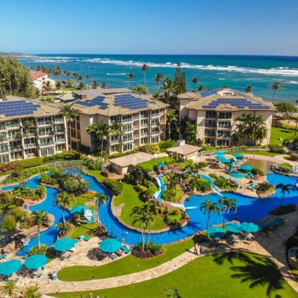 15 Top-Rated Budget Hotels On Kaua'i: Affordable Luxury Hawaii Calling a resort with a pool and a body of water