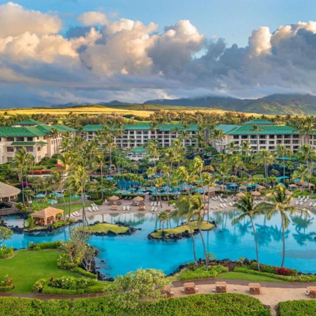 12 Best Family Hotels On Kaua'i for a Dream Hawaiian Vacation Hawaii Calling a resort with a pool and palm trees