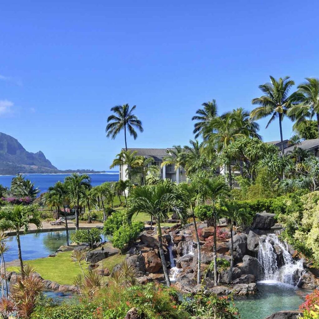 12 Best Family Hotels On Kaua'i for a Dream Hawaiian Vacation Hawaii Calling a waterfall in a tropical garden