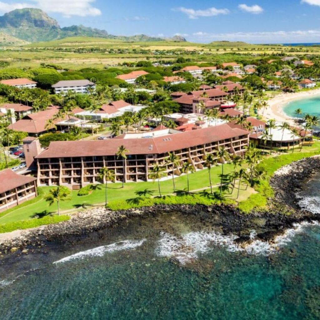 12 Best Family Hotels On Kaua'i for a Dream Hawaiian Vacation Hawaii Calling a group of buildings next to a body of water
