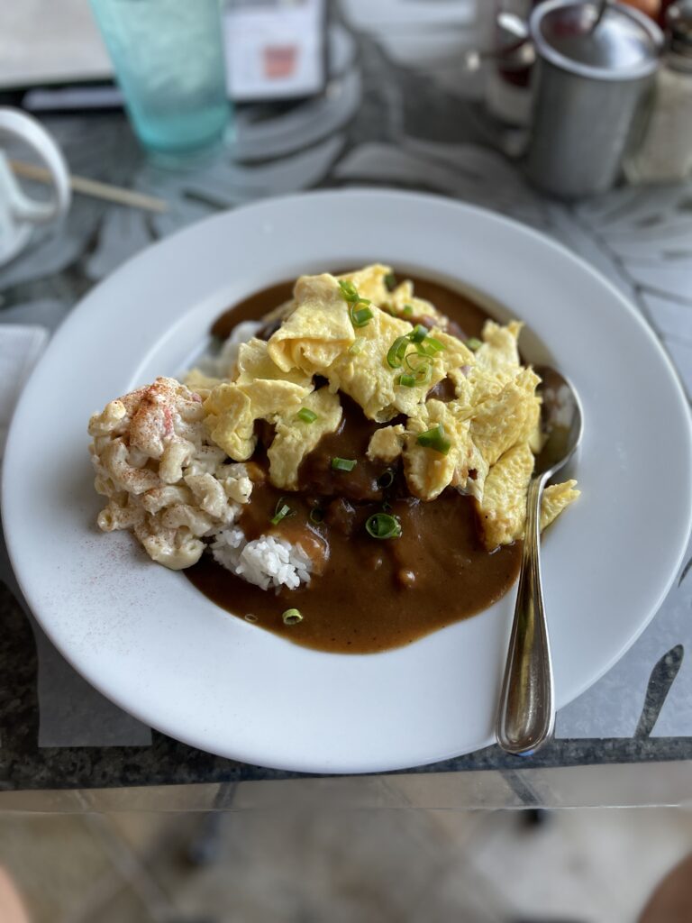 10 Best Loco Moco Spots In Waikiki, Oahu | A Foodies Guide (2025) Hawaii Calling a plate of food with a spoon