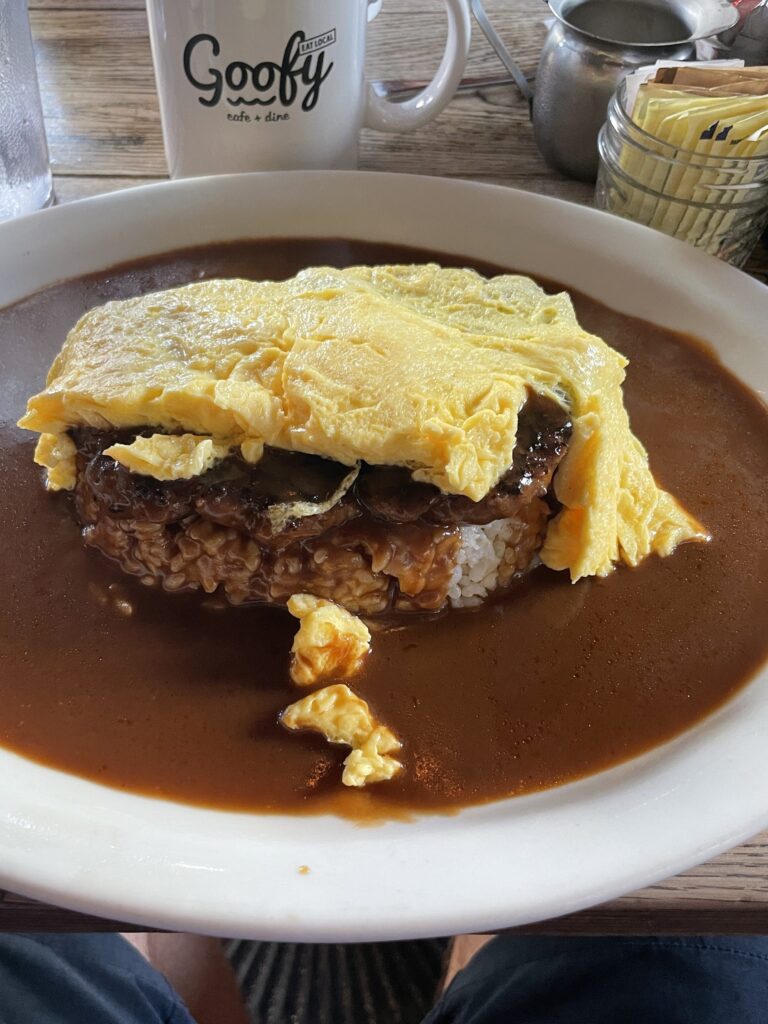 10 Best Loco Moco Spots In Waikiki, Oahu | A Foodies Guide (2025) Hawaii Calling a plate of food with brown sauce and omelette