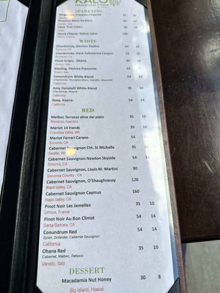 Kalo Hawaiian Food by Chai's | Unique Flavors In Waikiki Hawaii Calling a menu on a table