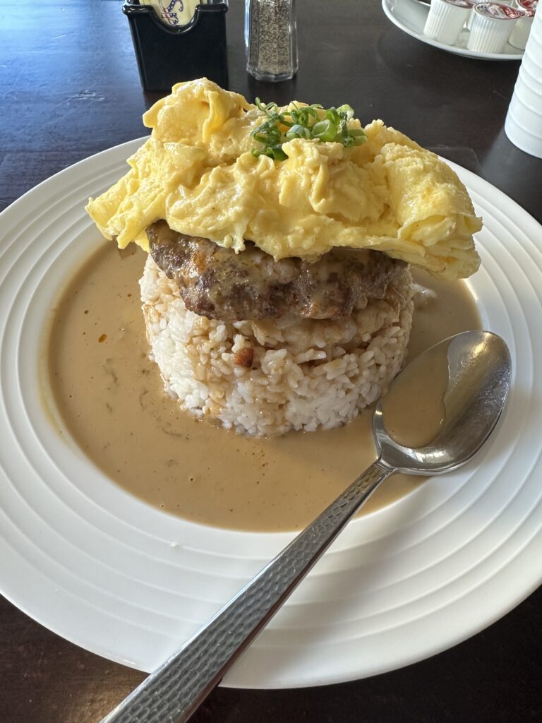 Kalo Hawaiian Food by Chai's | Unique Flavors In Waikiki Hawaii Calling a plate of food with a spoon