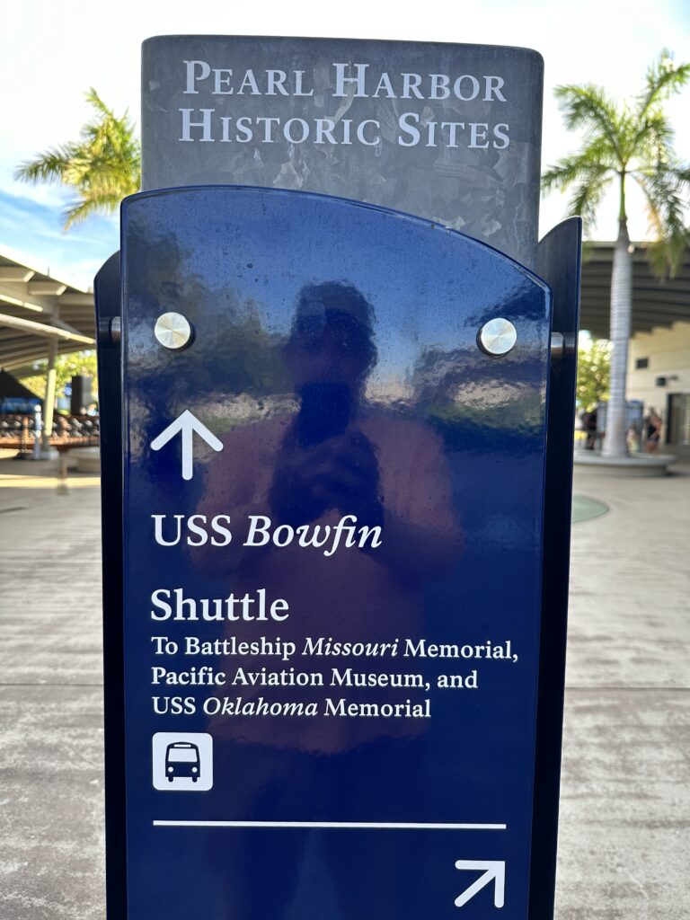 Volunteering At The Battleship Missouri Memorial | Amazing History Behind The Scenes Hawaii Calling One of the signs that direct you where to go when volunteering at the USS Missouri