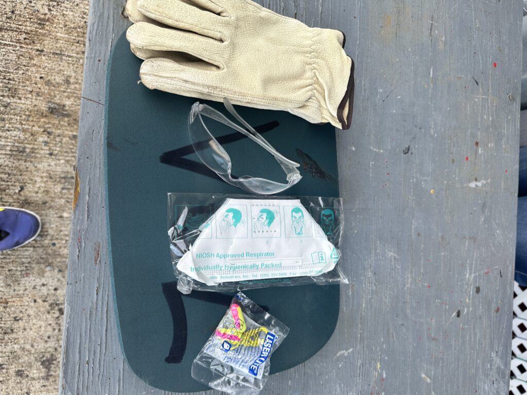 Volunteering At The Battleship Missouri Memorial | Amazing History Behind The Scenes Hawaii Calling a pair of gloves and face mask on a skateboard