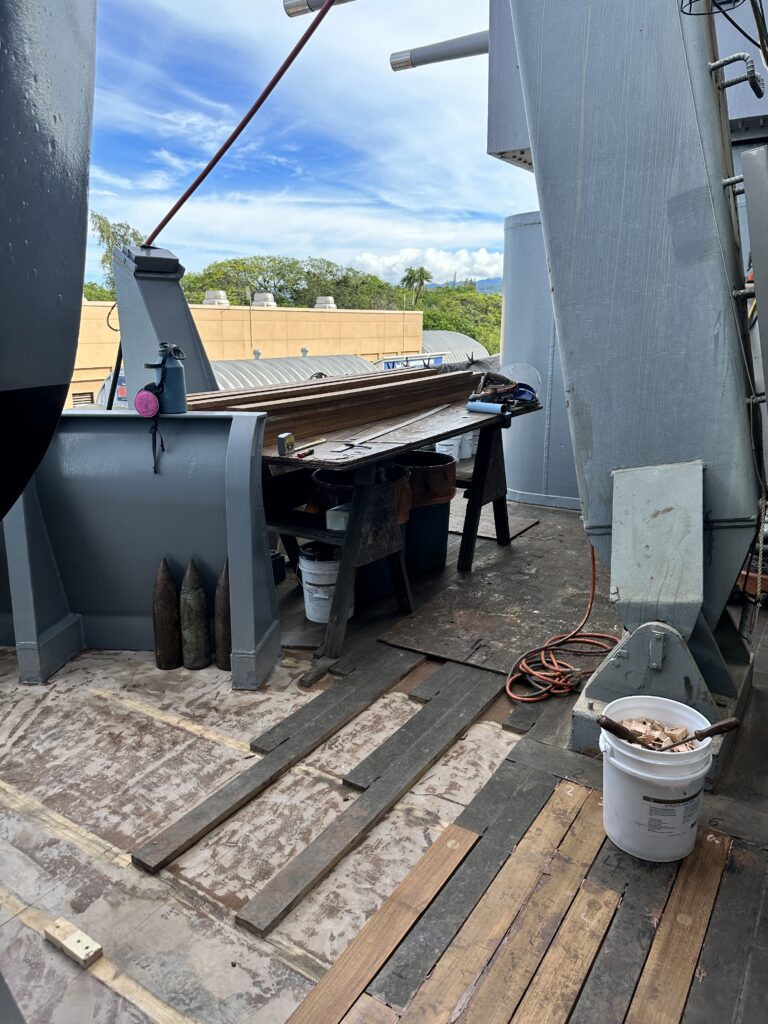 Volunteering At The Battleship Missouri Memorial | Amazing History Behind The Scenes Hawaii Calling a metal table on a deck