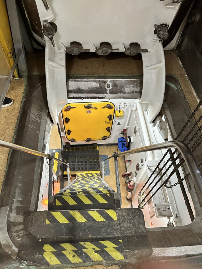 Volunteering At The Battleship Missouri Memorial | Amazing History Behind The Scenes Hawaii Calling a stairs leading to a white and yellow door