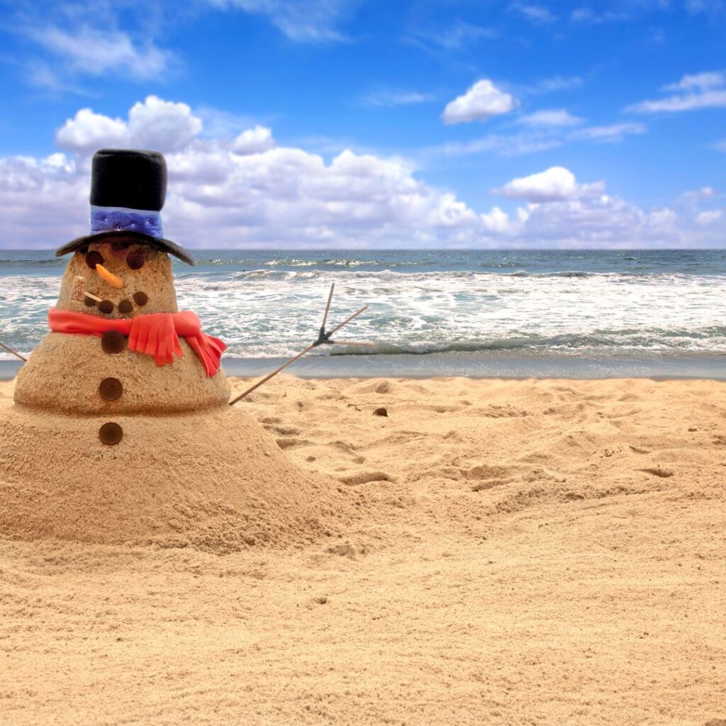 What's the Best Island to Visit in Hawaii in December (2025)? Hawaii Calling a snowman made of sand on a beach