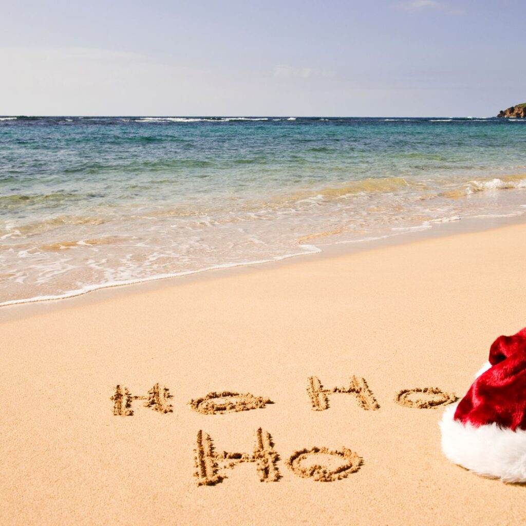 What's the Best Island to Visit in Hawaii in December (2025)? Hawaii Calling a santa hat on a beach