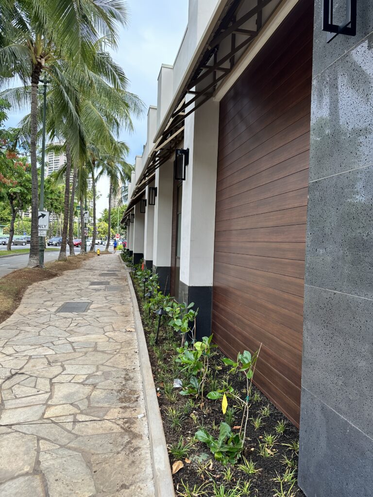Romer Waikiki Sneak Peek | Renovations Complete Hawaii Calling a building with a garage door
