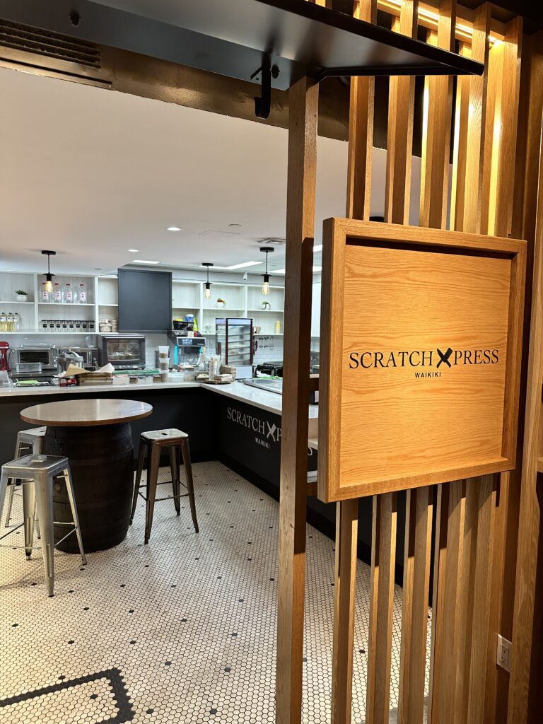 STIX Waikiki: A Foodie's Paradise in the Heart of Waikiki Beach Hawaii Calling a wooden sign in a restaurant