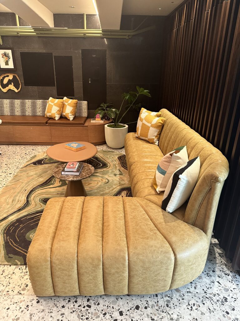 Romer Waikiki Sneak Peek | Renovations Complete Hawaii Calling a couch and a coffee table in a room