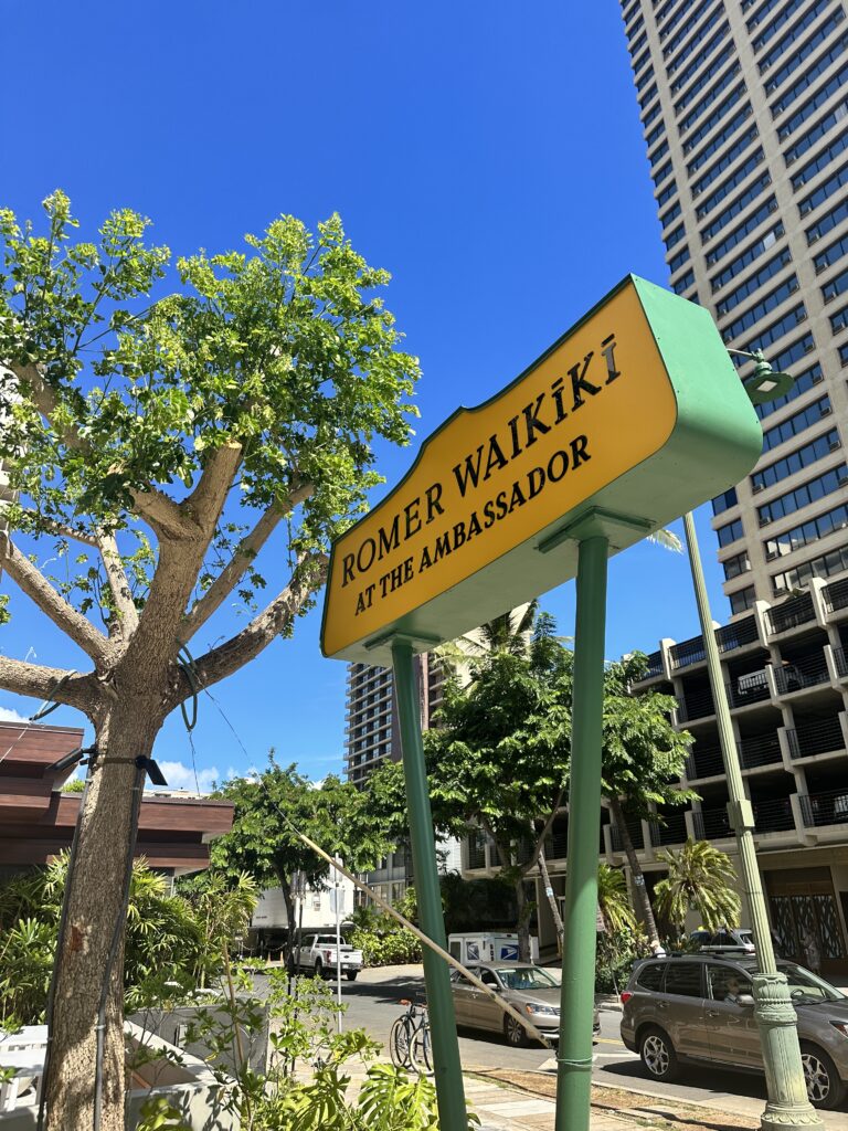 Romer Waikiki Sneak Peek | Renovations Complete Hawaii Calling a sign on a street