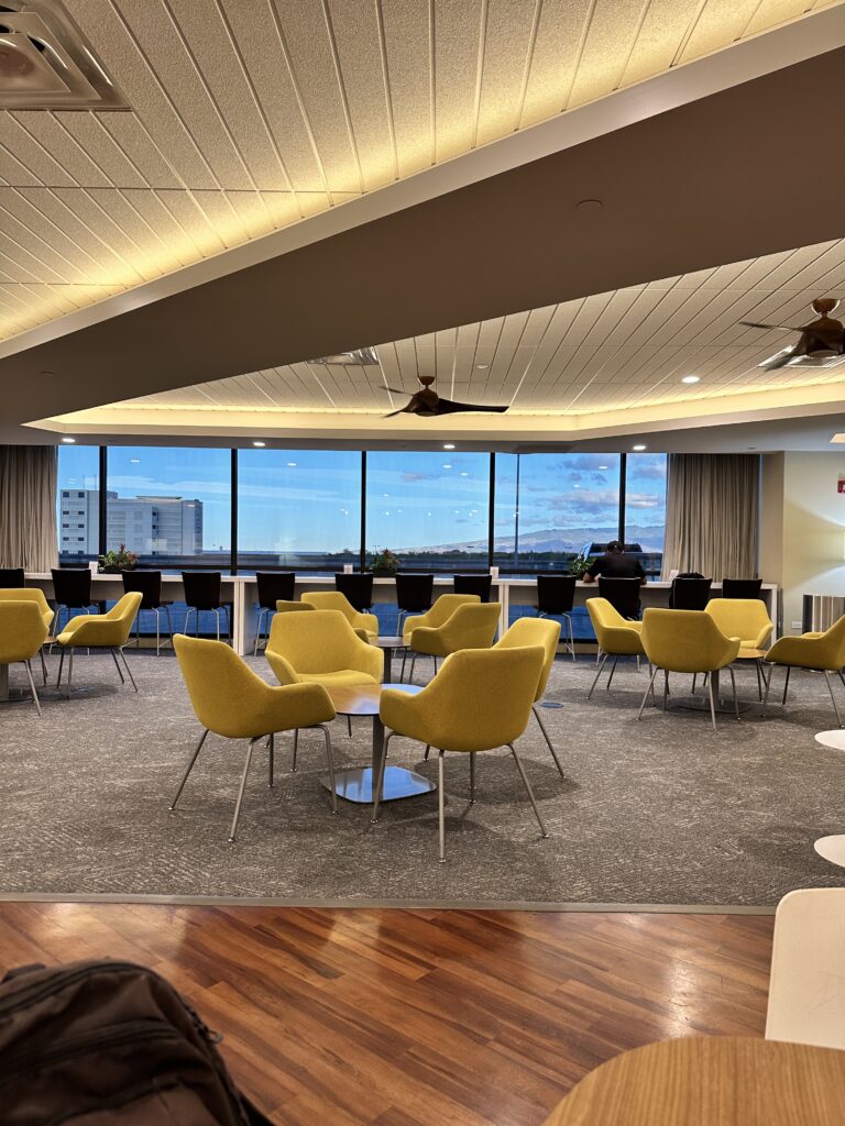 Review: Hawaiian Airlines Boeing 717 Economy HNL-KOA Hawaii Calling a room with yellow chairs and a table