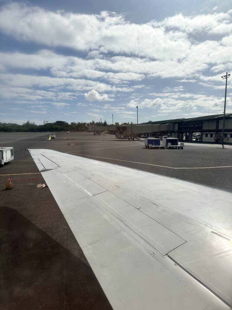 Review: Hawaiian Airlines Honolulu to Hilo | Boeing 717 | HNL-ITO Hawaii Calling an airplane wing on a tarmac